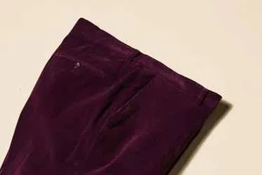 Certainly! To optimize the title for an e-commerce product, youll want to include key details that make the product more appealing and improve searchability. Here is an optimized version:

Stylish Deep Violet Velvet Flat Front Pants - Mens Elegant Trousers P502-166

This title includes the color, material, style, and intended audience to maximize clarity and attractiveness.